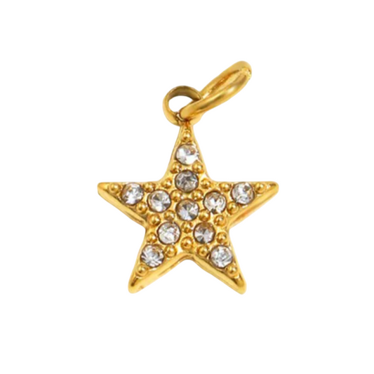 Gold star-shaped pendant with embedded crystals on a white background